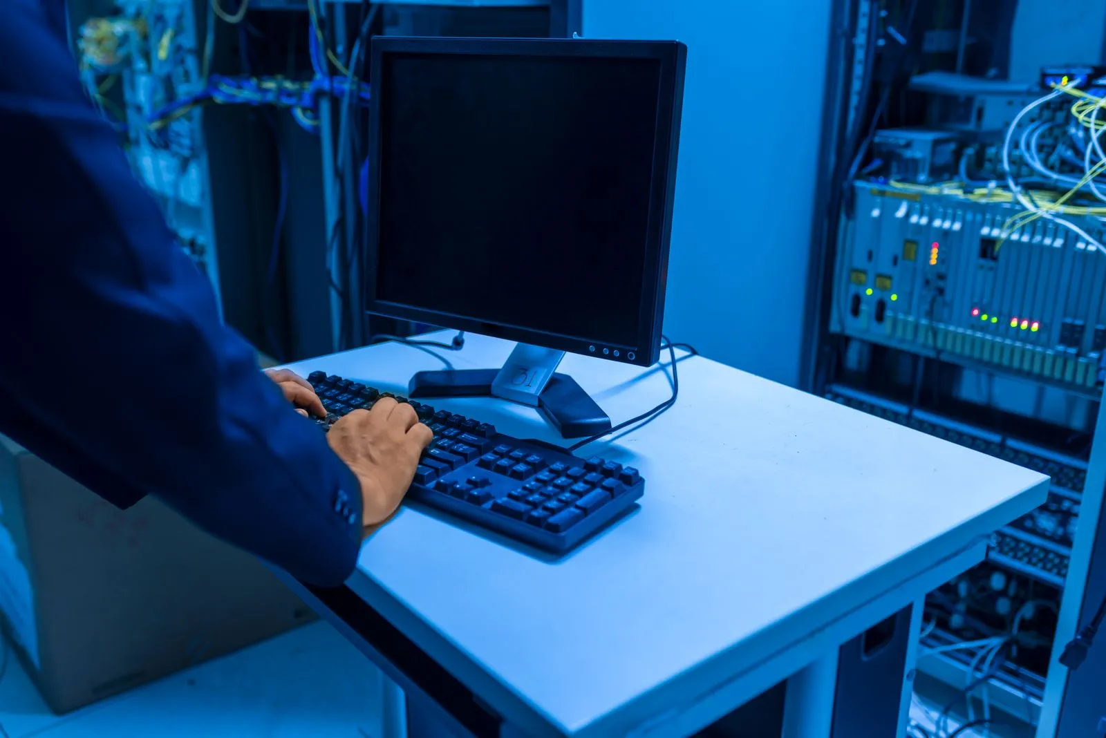 Computer Point engineer servicing IT infrastructure in a network room